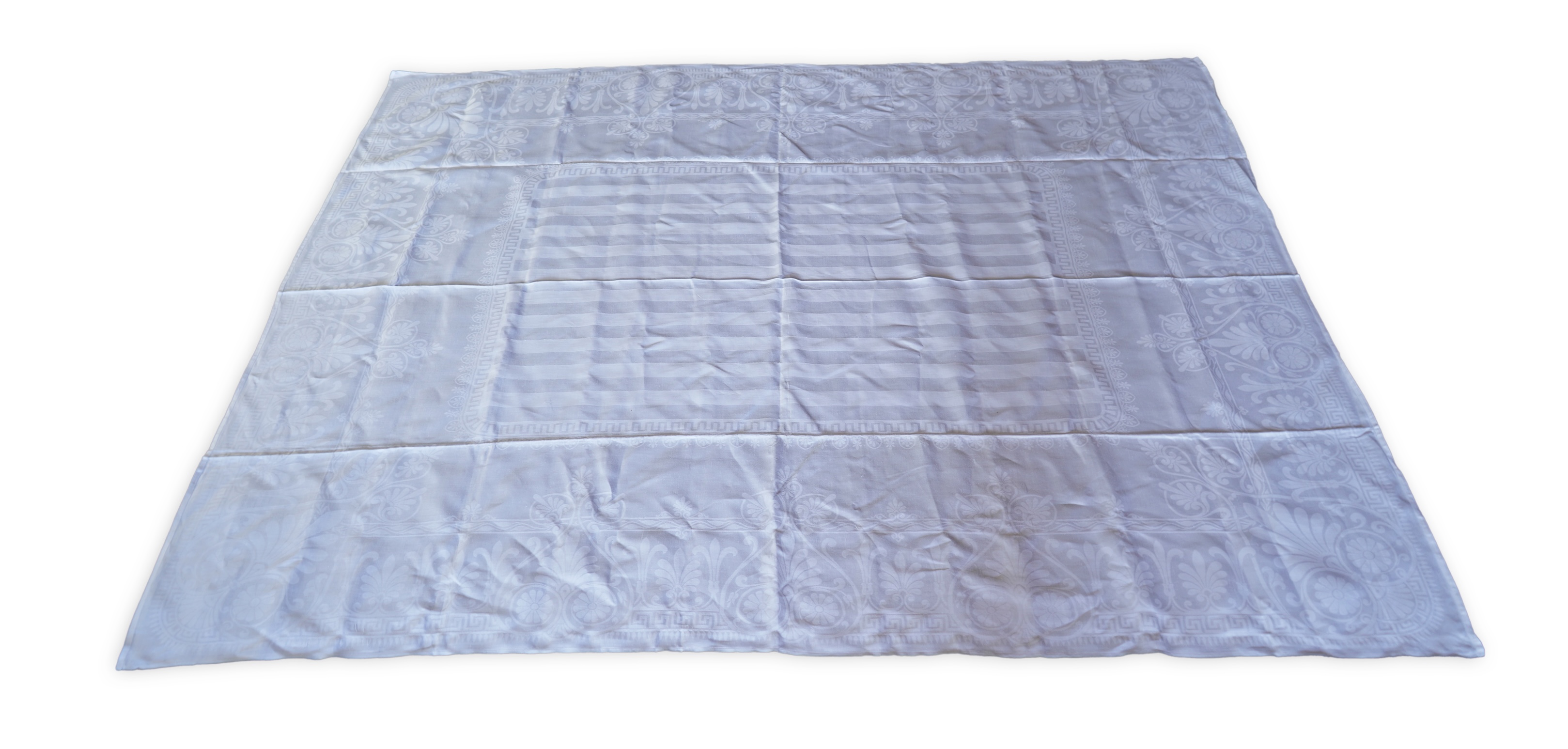A late 19th century large white Irish damask table cloth, woven with an all over Christopher Dresser ‘inspired’ design. The overall design incorporating many of his known stylistic design motifs. Each corner has a shamro